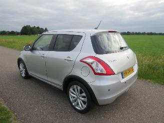 Damaged car Suzuki Swift 1.2 94pk  Automaat 5Drs 68.000km Nap Airco Exclusief  2015-12 2015/12